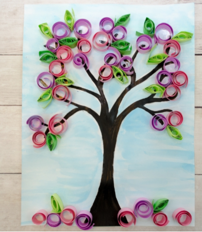 Cherry blossom painting added rolled pink and purple paper flowers and green paper leaves on it