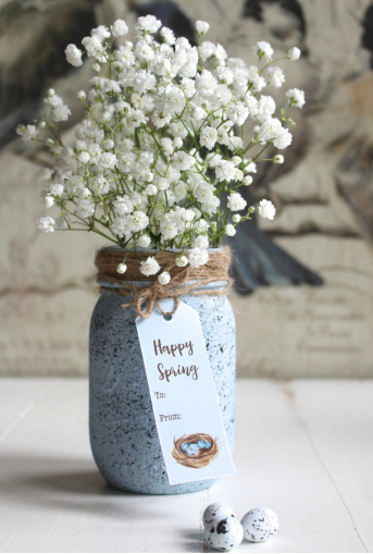 Specked Robin's Egg Mason Jar with a tag that says Happy Spring To: From: and a beautiful with flowers coming out