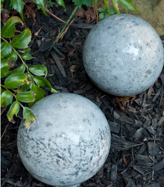 Homemade concrete garden balls display 