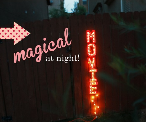 A homemade marquee sign for backyard movie night