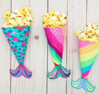 A magical and colorful mermaid movie night printable popcorn holder for the summer