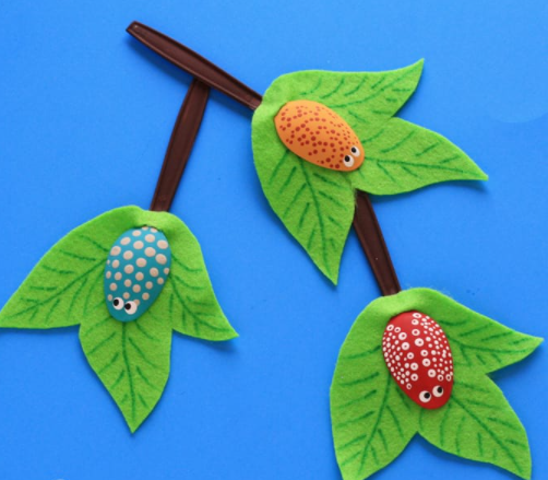 Plastic spoons turned into cute little bugs on branches