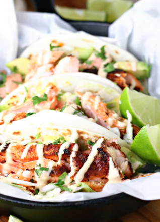 A seafood Chile lime salmon tacos with tortillas and tangy cabbage slaw