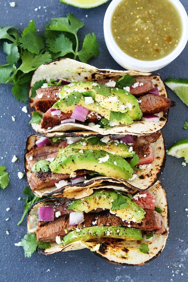 Grilled steak tacos with red onion, avocado, cilantro, and queso fresco for the summer 