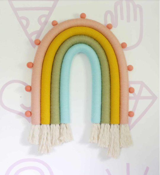 Rainbow wall hanging with tassel at the bottom