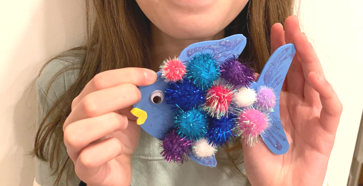 A colorful rainbow fish craft ornament for kids