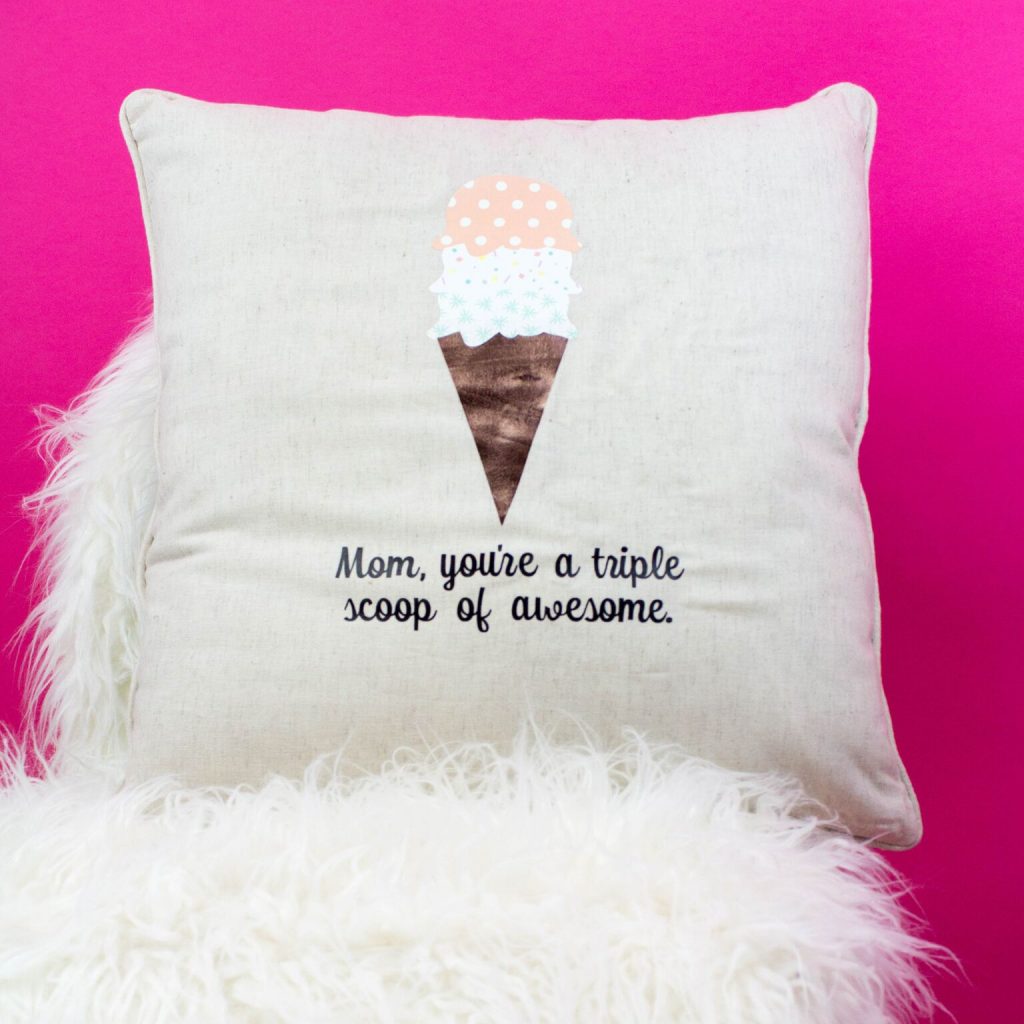 DIY pillow for Mom, with a cute ice cream design at the middle and a text saying Mom, you're a triple scoop of awesome.