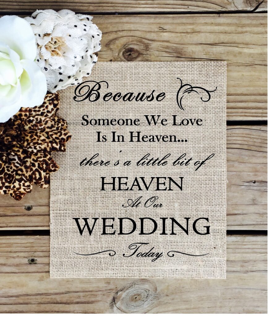 Burlap wedding sign with text saying Because Someone We Love Is In Heaven there's a little bit of HEAVEN At Our WEDDING Today
