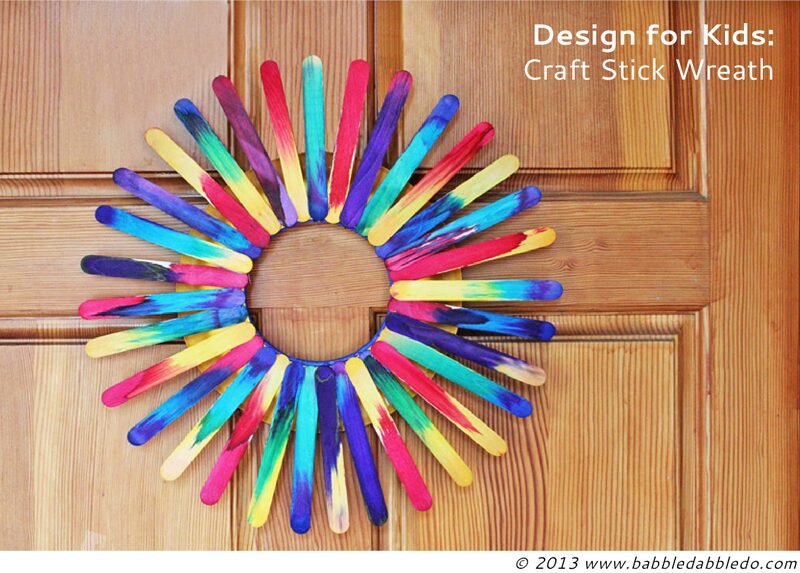 A handmade and colorful craft stick wreath door hanging home decor 