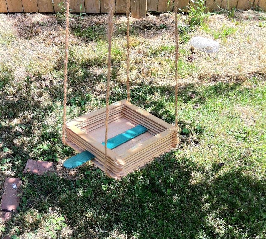 An easy to make bird feeder craft made of popsicle sticks 