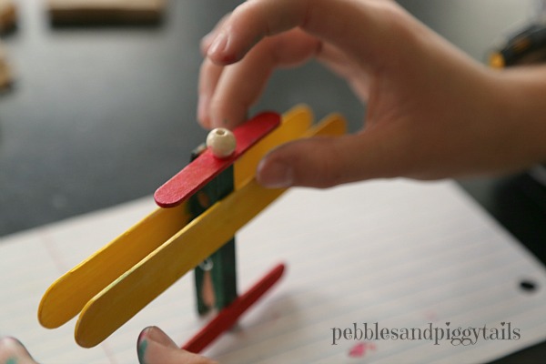 A fun, exciting, and easy to make popsicle stick airplane craft for kids