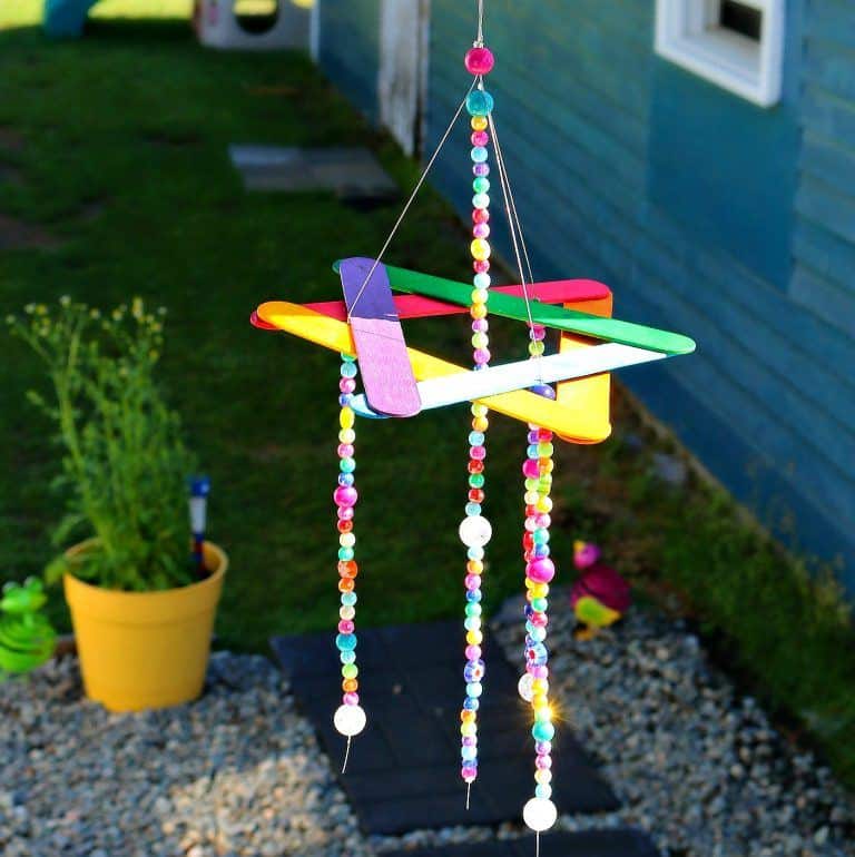 A cute and easy to make wind chime made of popsicle stick perfect for the garden and kids craft