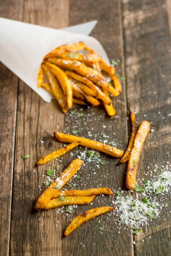 Baked pumpkin fries coated with parmesan cheese