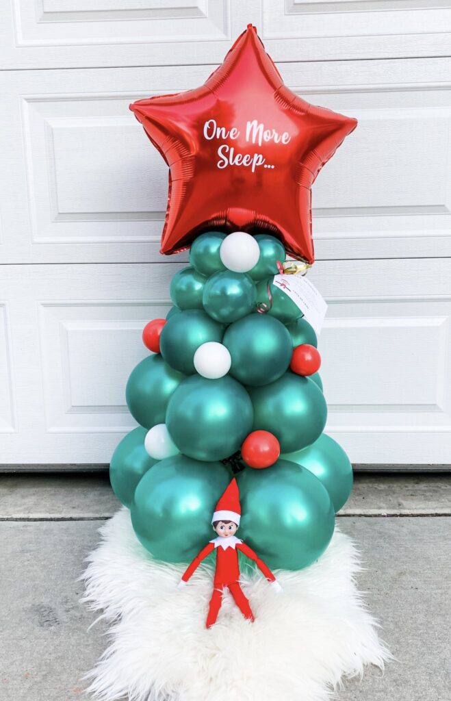 Elf On The Shelf Sendoff party with colorful christmas tree