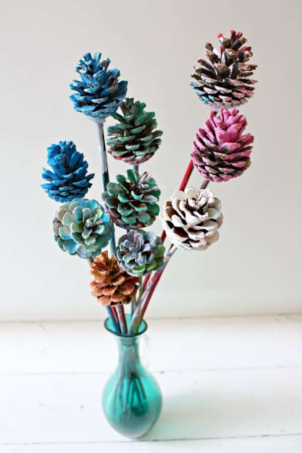 painted pine cone in a vase colorful decor for the fall season