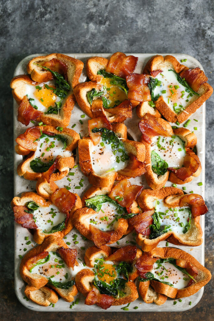 Bacon and egg toast cups garnished with chives