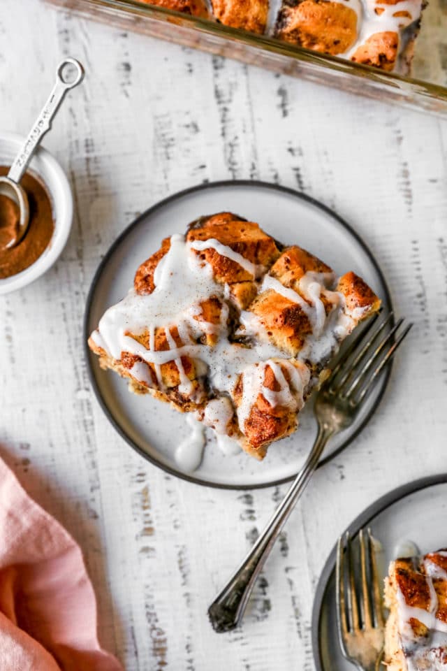 Cinnamon roll casserole drizzled with icing over the top 