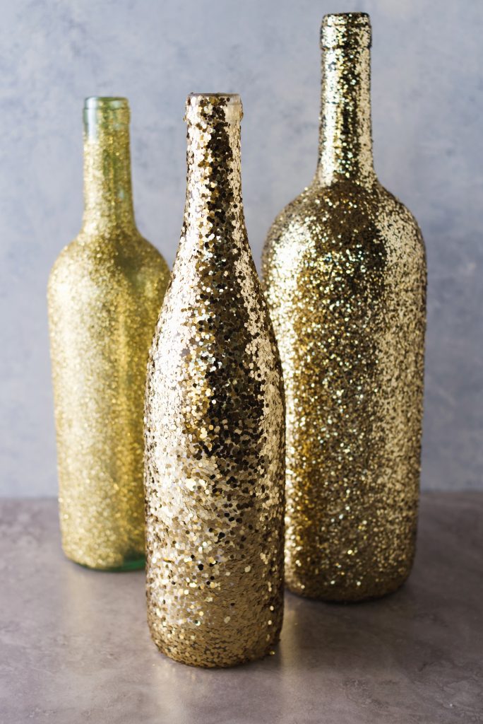 DIY Wine Bottle Glitter Vases Project for the Holidays