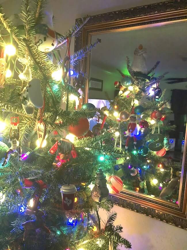 elf on the shelf is hiding in the christmas tree