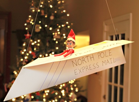 elf on the shelf is on a plane to the north pole