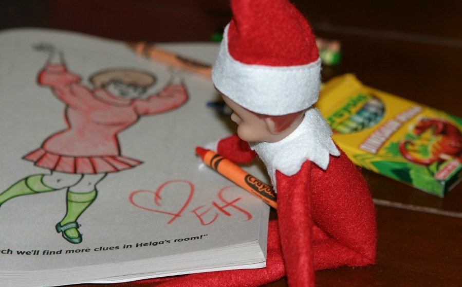 elf on the shelf is doing a coloring book activity