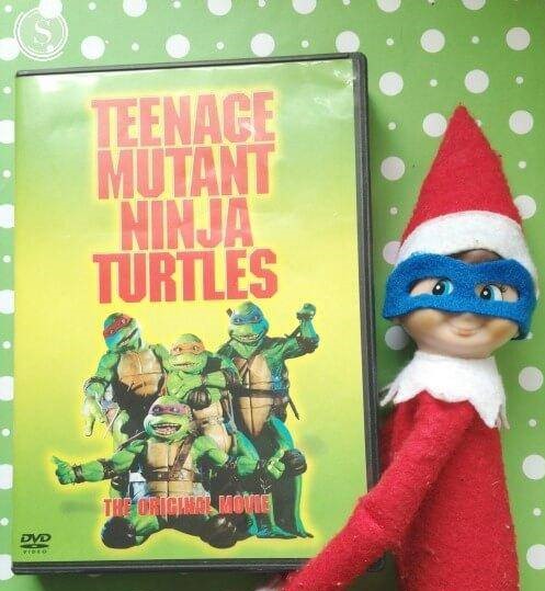 elf on the shelf watching teenage mutant ninja turtle