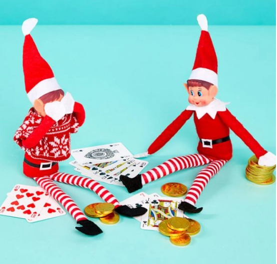 elf on the shelf playing poker games with a friend