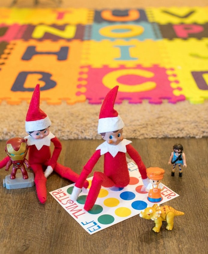 elf on the shelf is paying twister with a friend
