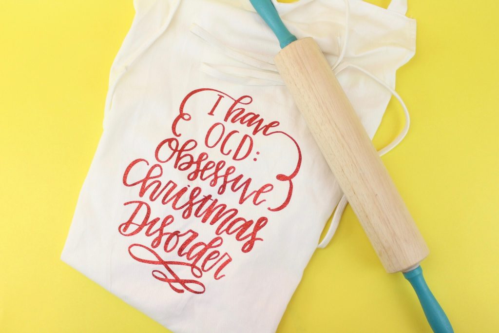 Holiday apron with text on it saying I have OCD: obsessive Christmas disorder
