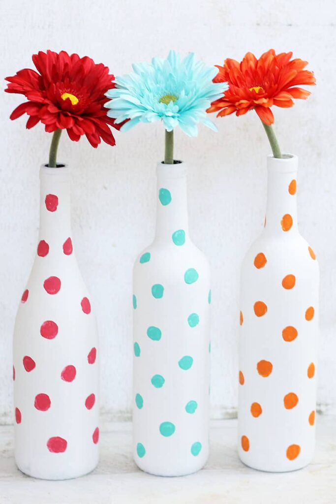 Painted wine bottles polka dot vases