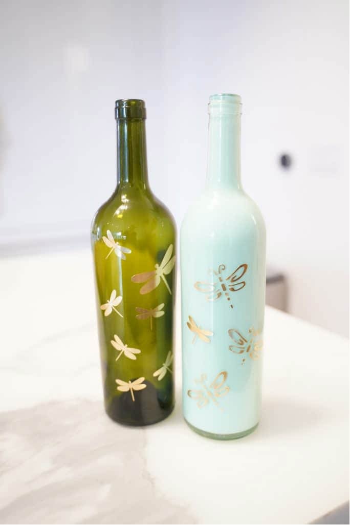 Painted wine bottles with dragonfly details