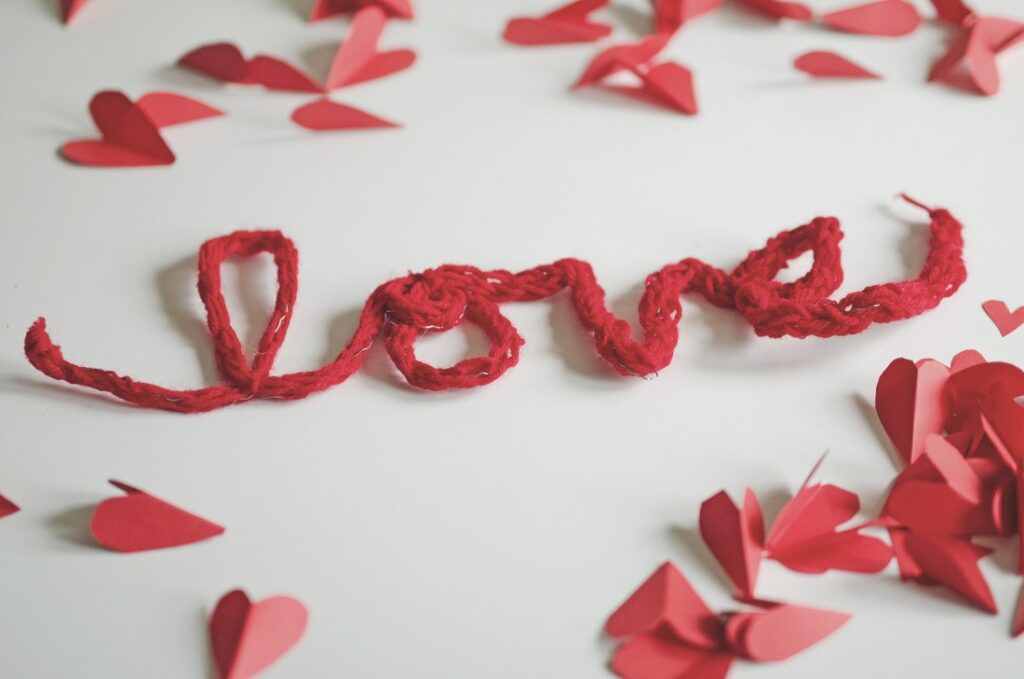 Finger knitted love decorations