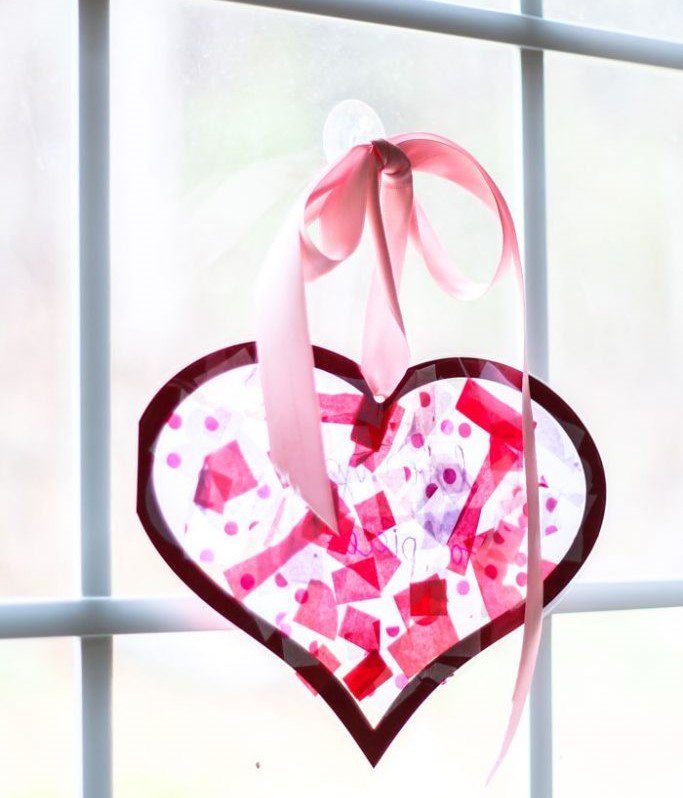 Heart shaped tissue paper stained glass with a text at the center of the heart saying “I Love You to Pieces” 
