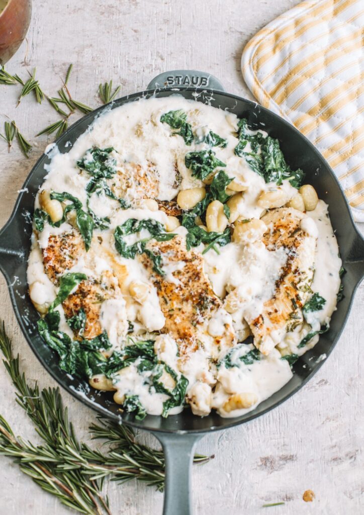 CREAMY CHICKEN GNOCCHI BAKE recipe with rosemary garlic, rich cream sauce, tender baby spinach for winter