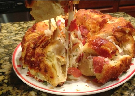 Easy Pull Apart Pizza Bread Recipe with a side of sauce as a dip
