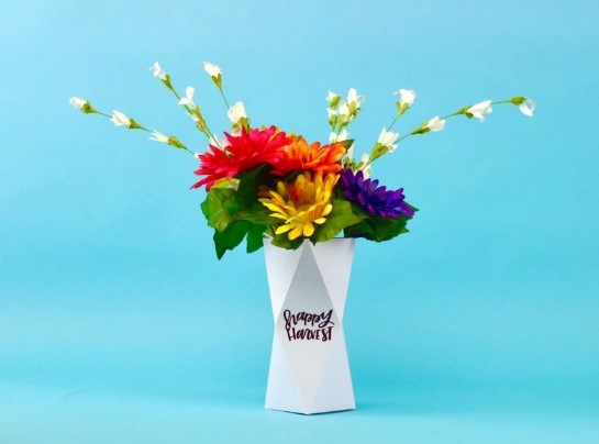 3D paper vase with cute vinyl quote at the center says Happy Harvest with beautiful flowers on it