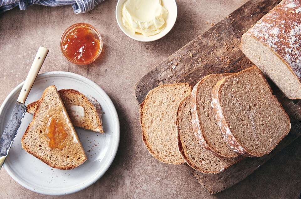 Ancient grain bread served with jam and butter