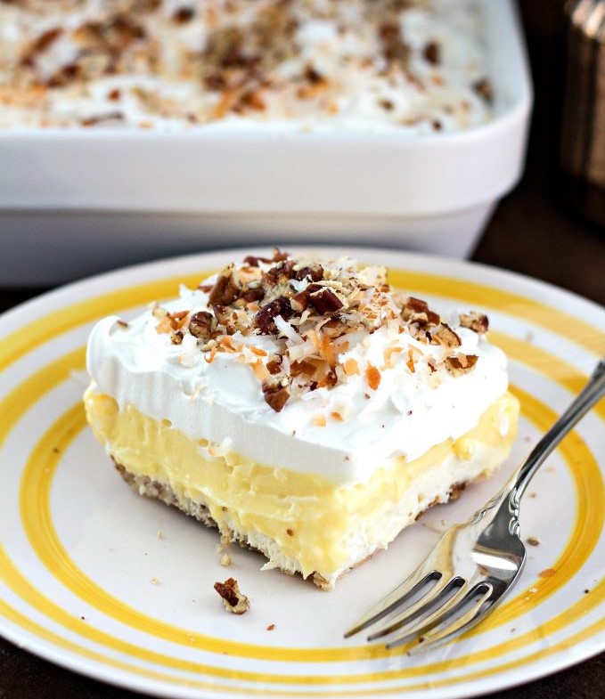 Coconut Cream Lush squares sprinkled with toasted pecans and coconut