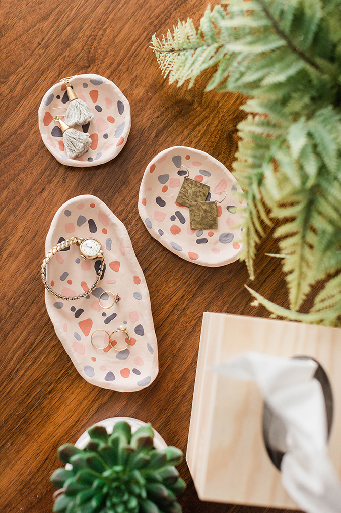 Clay faux terrazzo ring dishes with jewelries on it