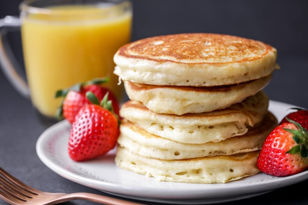 FLUFFY PANCAKES SERVE WITH BUTTERMILK SYRUP FOR BREAKFAST