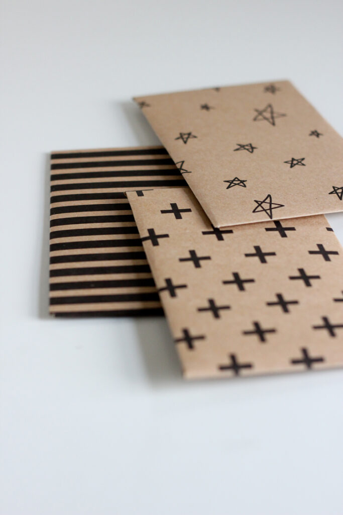 Stripe, star, and cross designed kraft paper gift card envelopes