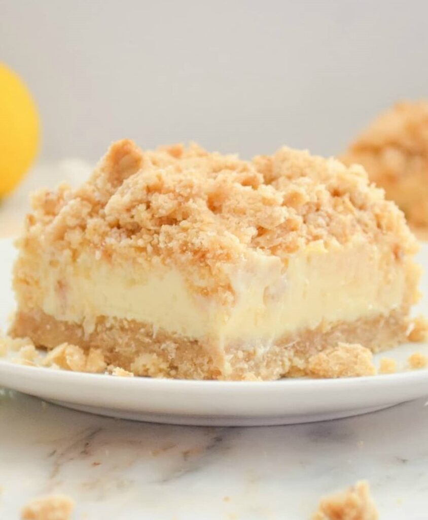 Delicious lemon cheesecake bar with a crumb topping