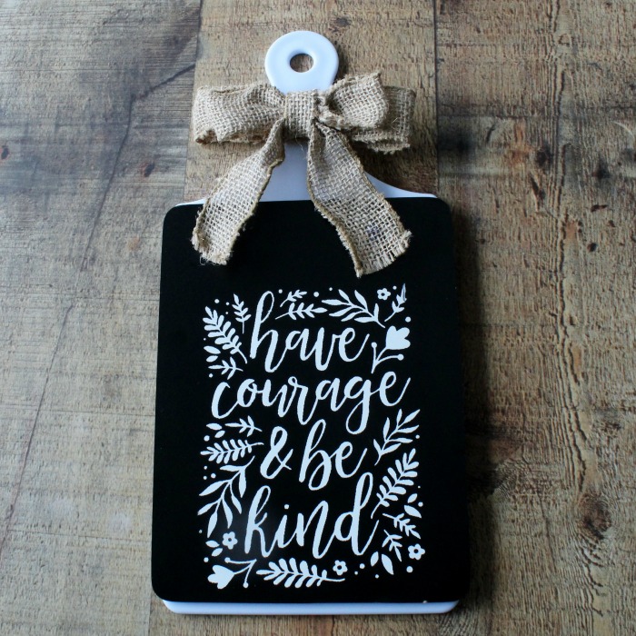 cute Dollar Tree Farmhouse DIY Chalkboard with a quote on it saying have courage & be kind