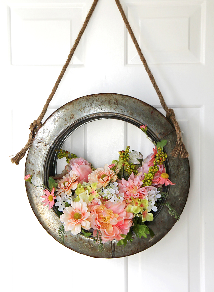 Farmhouse style spring wreath filled with happy blush pink and spring green flowers