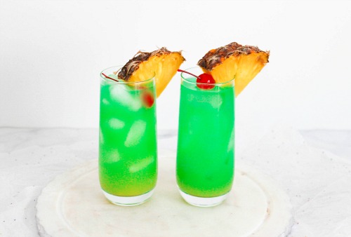 Blue Hawaii Mocktail Drink garnish with pineapple wedge and cherry