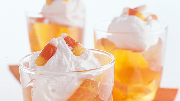 candy corn-inspired gelatin top with whipped cream and a few pieces of candy corn