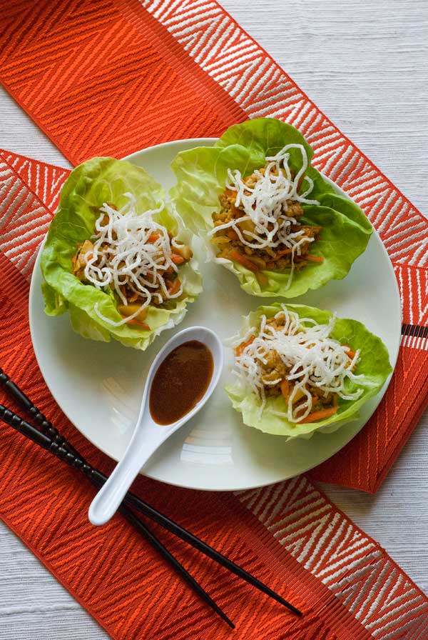 Gluten Free Chinese Chicken Lettuce Cups serve with a spoonful of San-J Asian BBQ Sauce