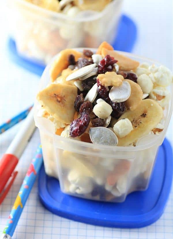 Healthy Lunchbox Snack Mix it has assorted rice crackers, banana chips, shredded coconut, raisins, dried cranberries, whole pumpkin seeds and popcorn