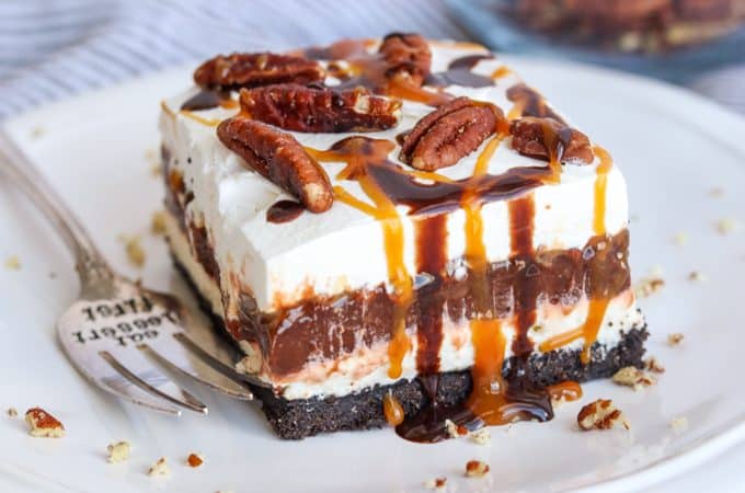 Delicious No Bake Turtle Dream Bar drizzle with caramel and chocolate sauces, and sprinkle with pecan pieces