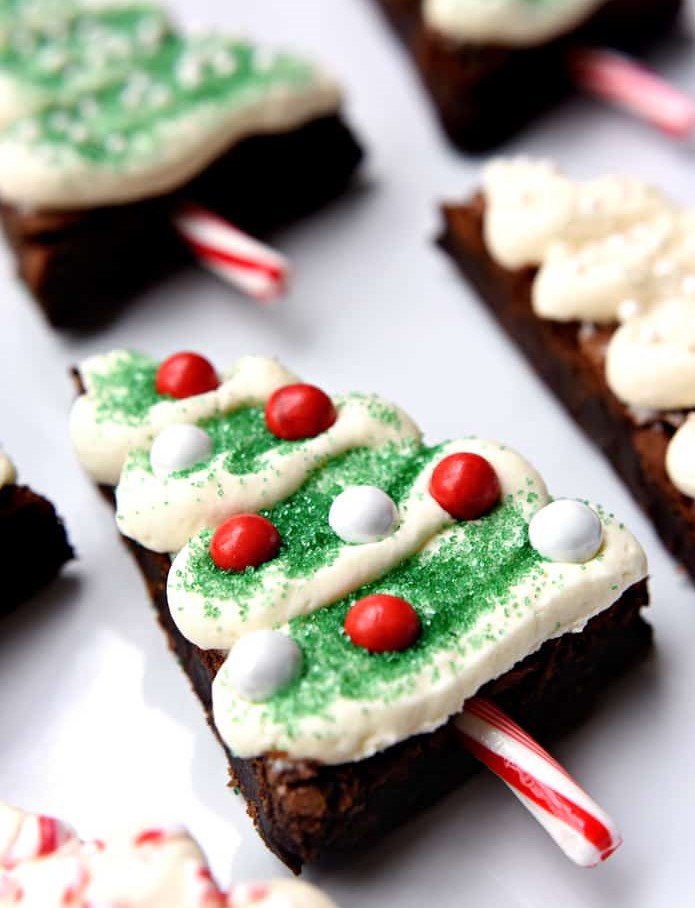 Christmas Tree Brownies with cream cheese frosting, and candy cane "trunks"